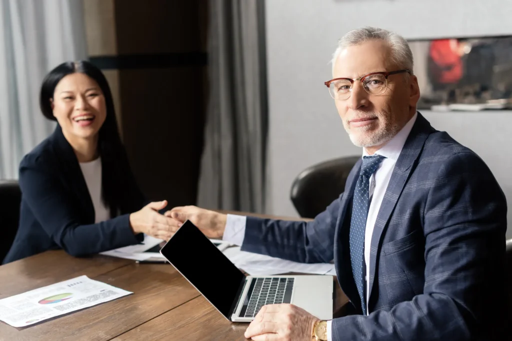 selective focus of businessman shaking hands with 2024 11 09 13 10 48 utc